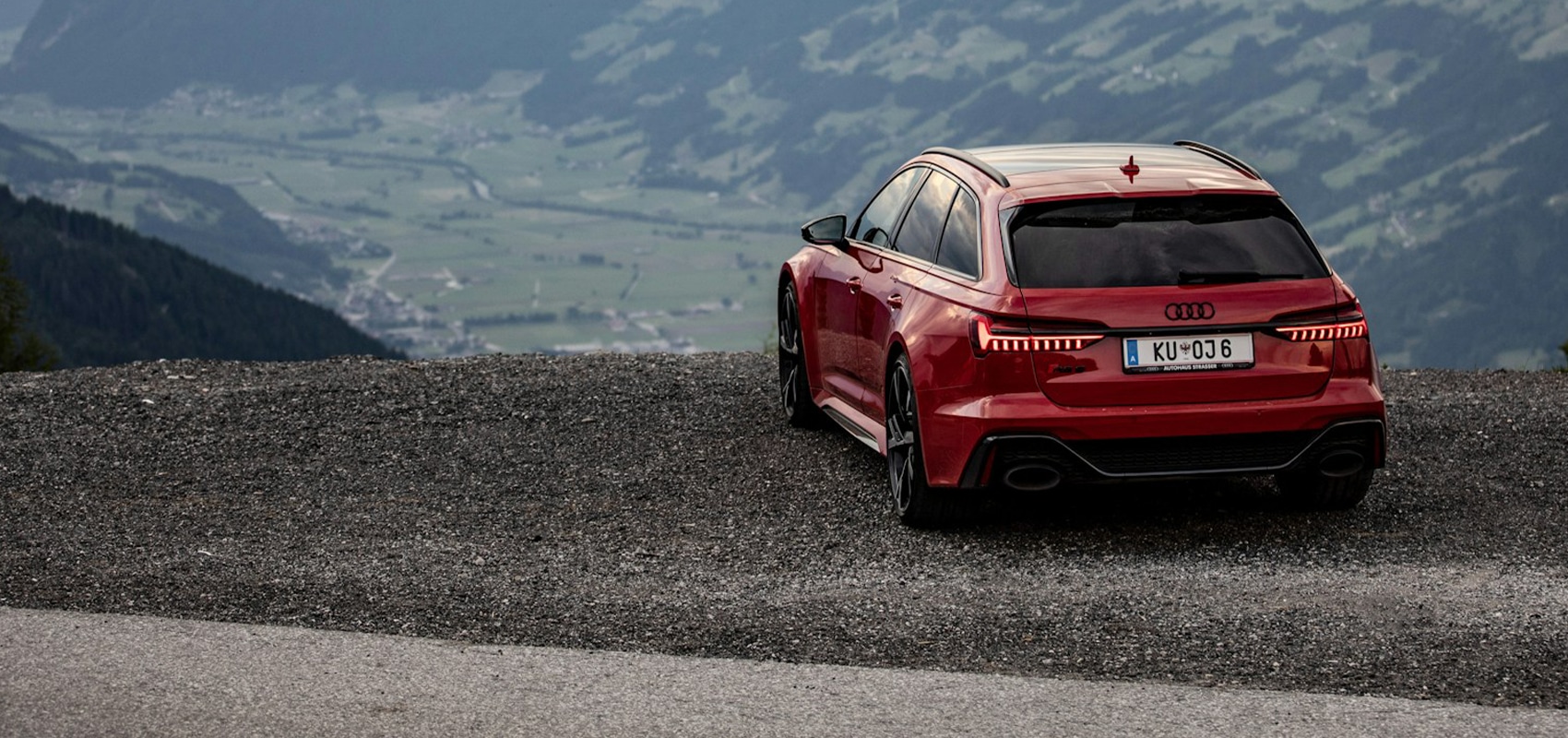 a car parked on the side of a mountain