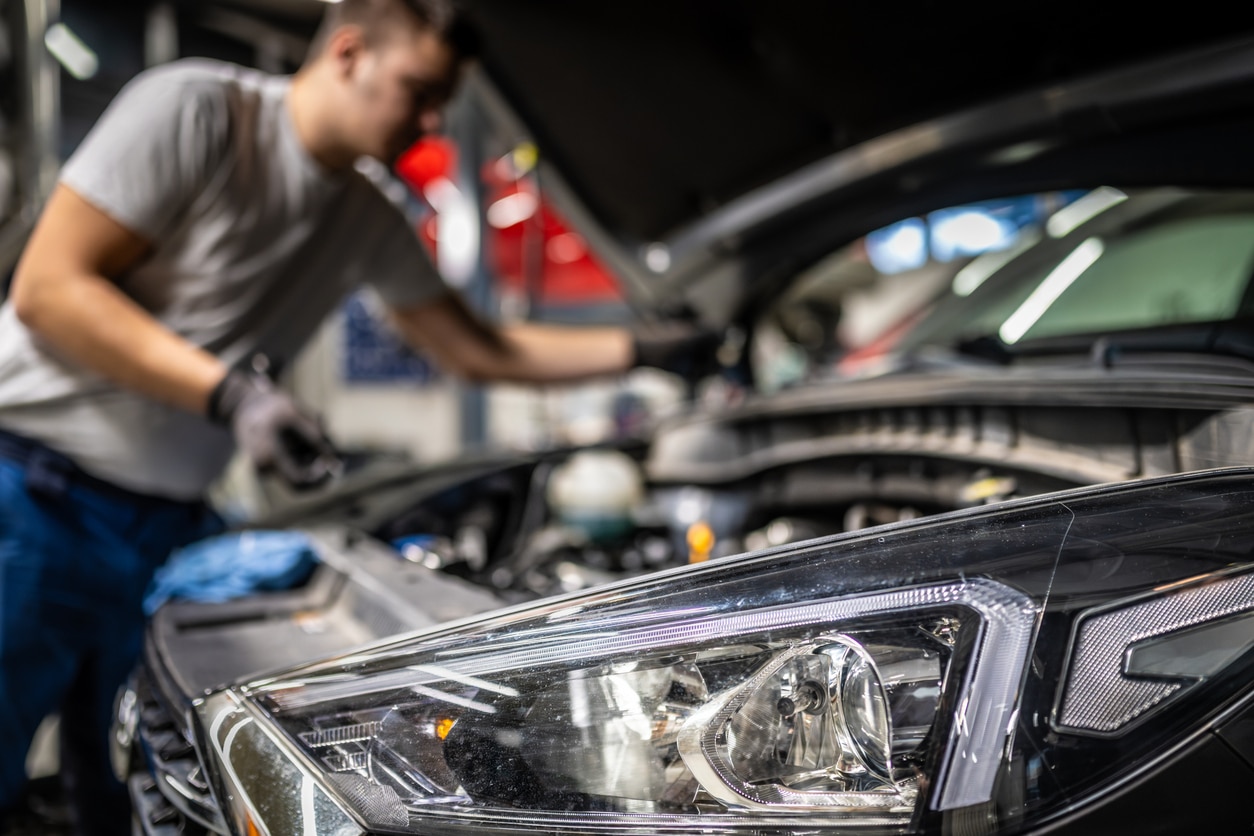 a man standing on top of a car